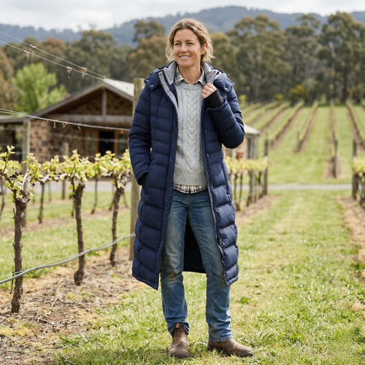 ELORA Maxi Vegan Thermal Puffer coat in Navy, worn by a woman in a Victorian vineyard, Yarra Valley Australia