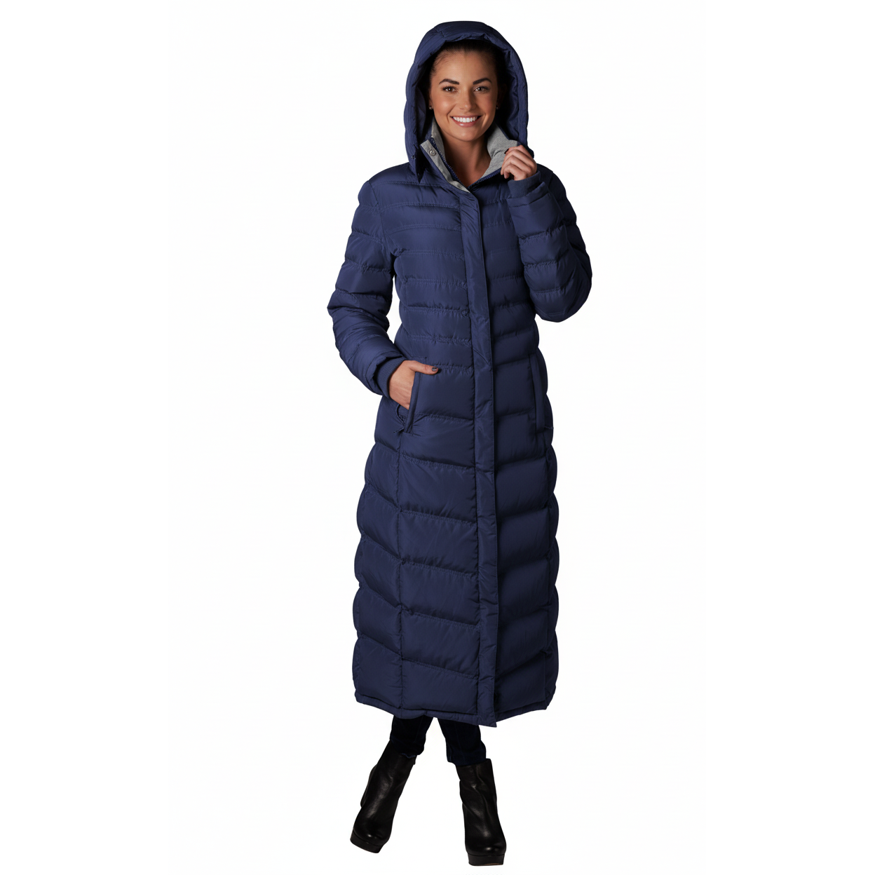 Woman wearing a long blue puffer coat on a white background