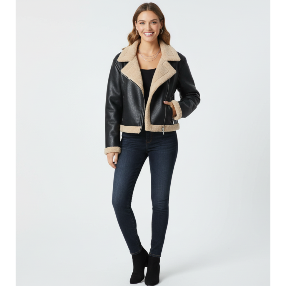 Woman wearing a black leather jacket with beige interior on a white background