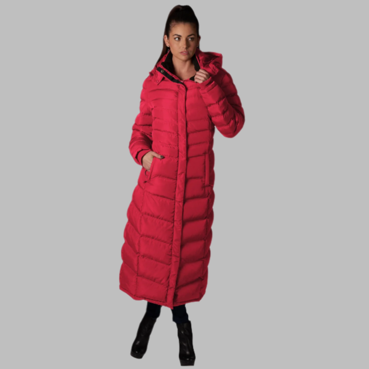 Full-Length Puffer Coat in bright red with quilted horizontal pattern, hood, and zippered pockets worn by a woman