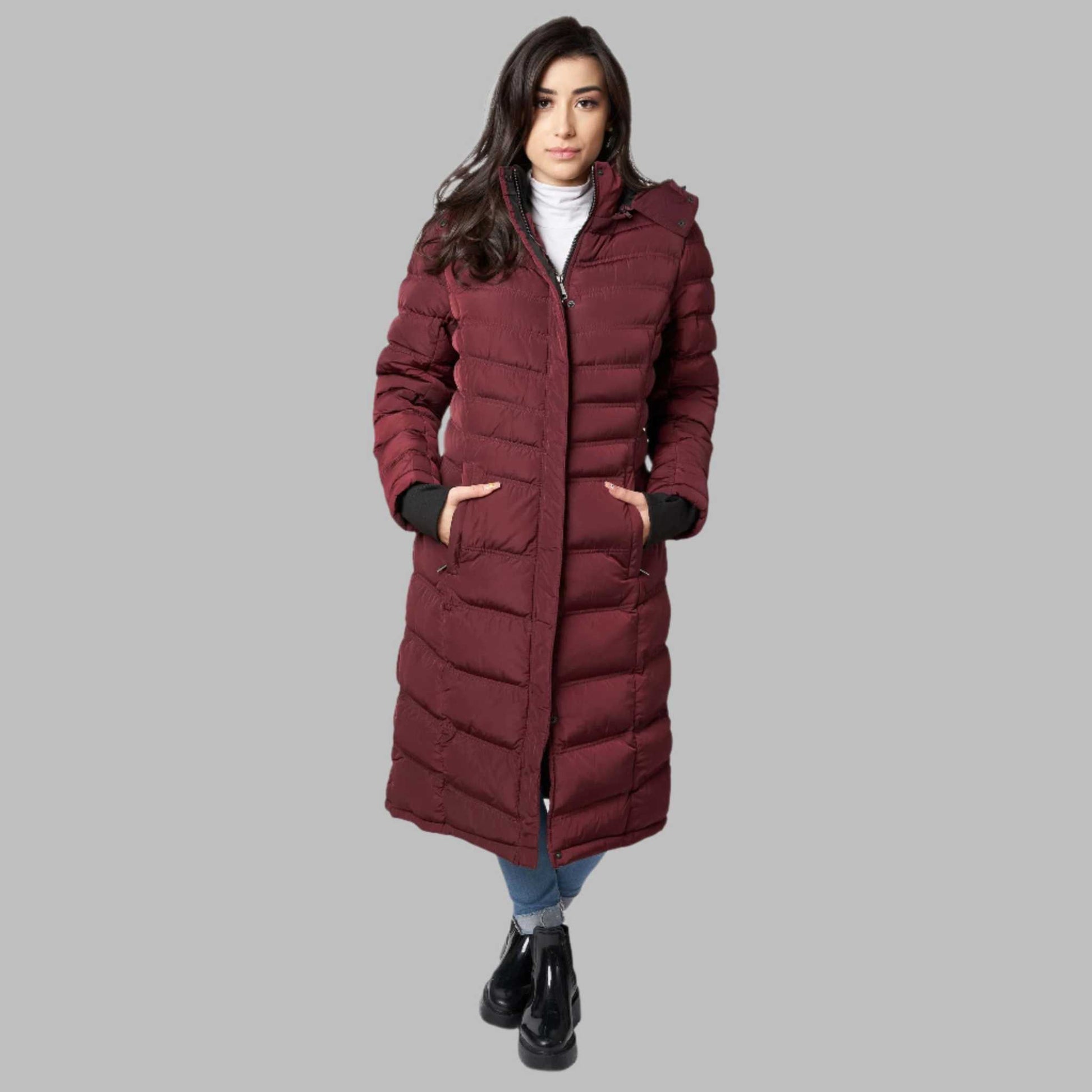 Warm vegan women's winter coat with front zipper and detachable hood.