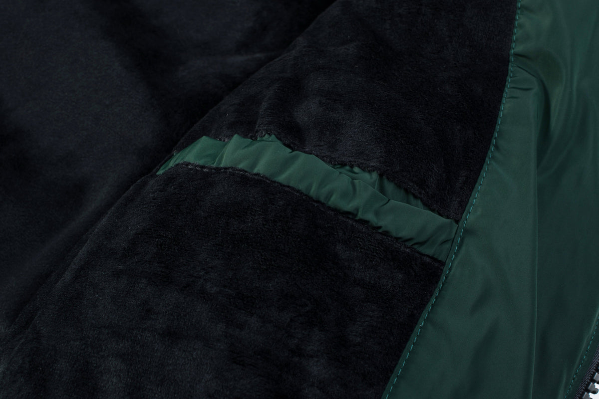 Actual Hunter Green ELORA 7609-8 parka interior pocket in the black fleece lining.