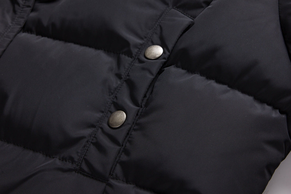 Black ELORA 2566 parka chest pocket with two metal snap closures.