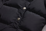 Black ELORA 2566 parka chest pocket with two metal snap closures.